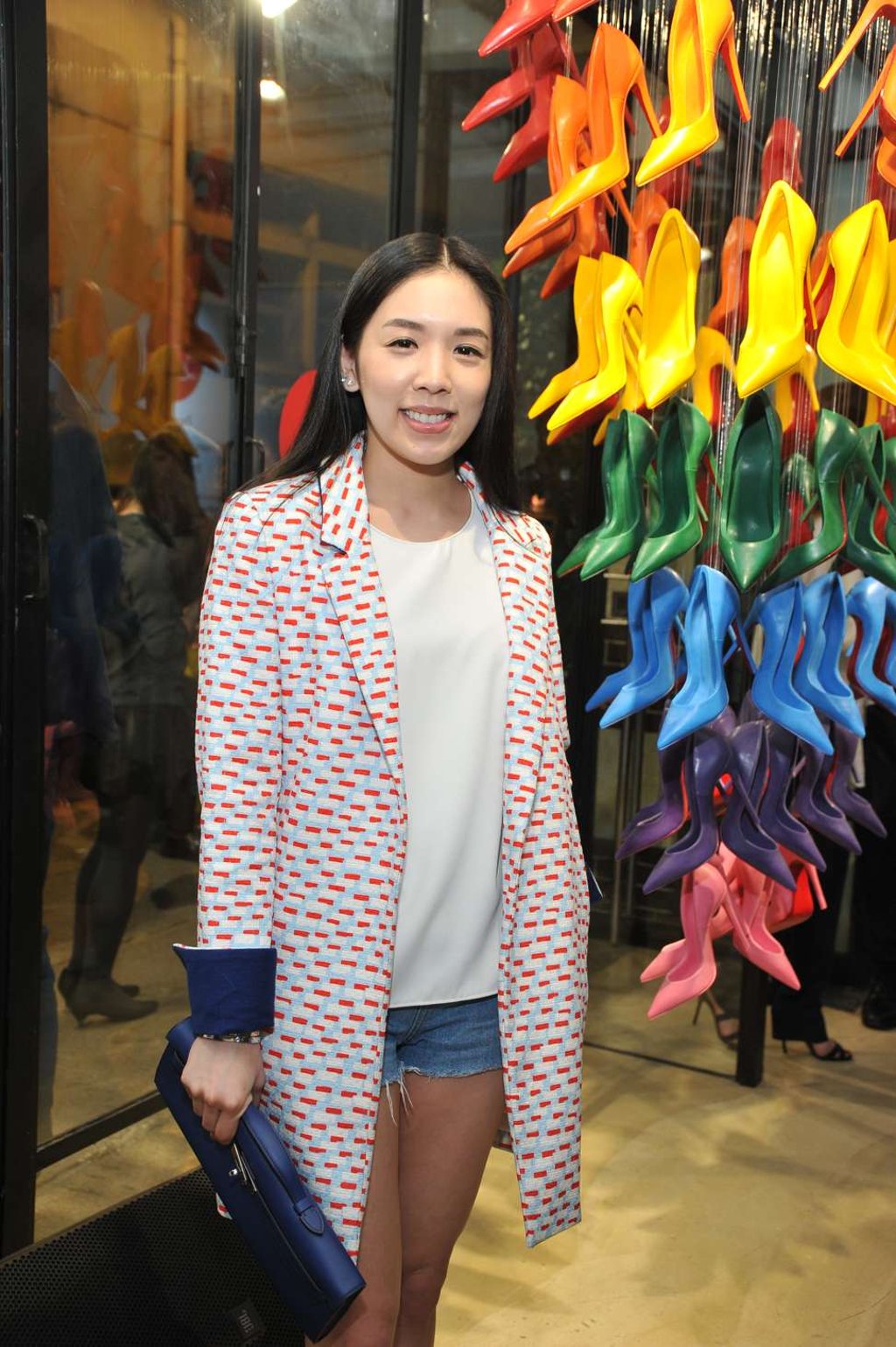 Socialite Carmen Yim posing next to the crayon So Kate