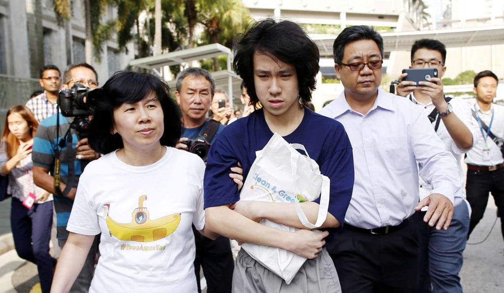 Teen blogger Amos Yee leaves with his parents after his sentencing from the State Court in Singapore. Photo: Reuters