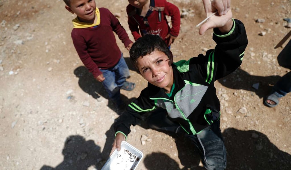 Syrian refugees are seen at the Zaatari camp which shelters some 80,000 Syrian refugees on the Jordanian border with war-ravaged Syria. Photo: AFP Syrian refugees are seen at the Zaatari camp which shelters some 80,000 Syrian refugees on the Jordanian border with war-ravaged Syria. Photo: AFP