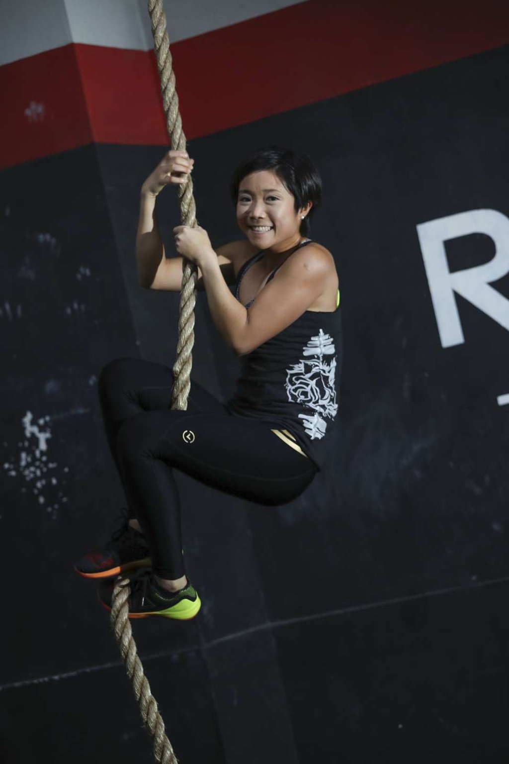 Vanessa Cheung does some rope climbing at the gym she co-owns in Chai Wan. Photo: Nora Tam