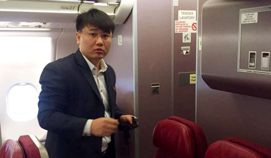A man believed to be Kim Uk-il, an employee of North Korea's national airline Air Koryo, is pictured on a plane ahead of its departure from Kuala Lumpur for Beijing on March 30. Kim and another North Korean man linked to the apparent assassination of Kim Jong-nam, arrived in Beijing in the early hours of March 31. Photo: Kyodo A man believed to be Kim Uk-il, an employee of North Korea's national airline Air Koryo, is pictured on a plane ahead of its departure from Kuala Lumpur for Beijing on March 30. Kim and another North Korean man linked to the apparent assassination of Kim Jong-nam, arrived in Beijing in the early hours of March 31. Photo: Kyodo