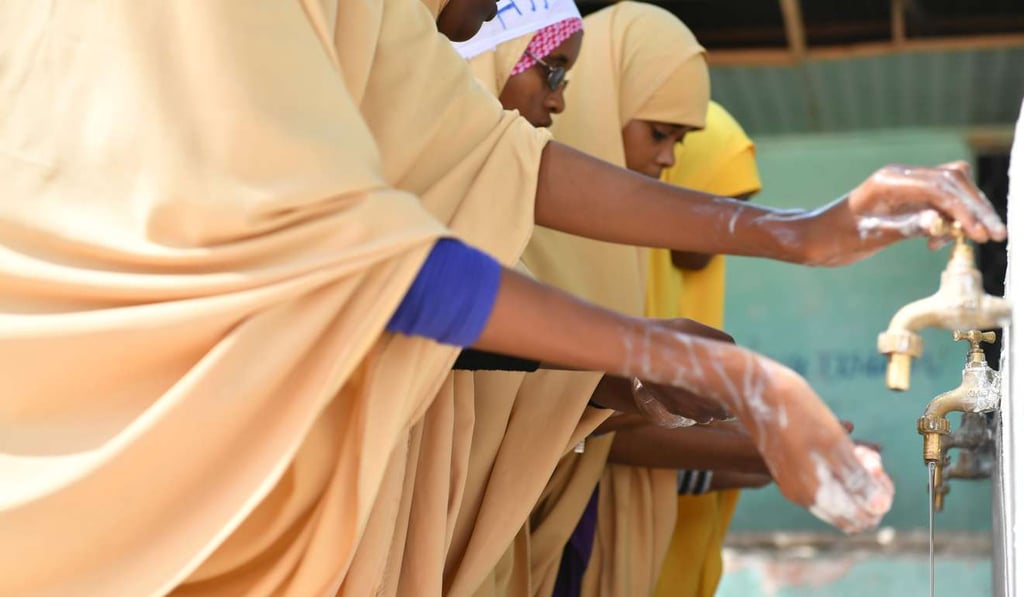 Students wash their hands with water from a well using a solar-powered pump at a school in Mogadishu, Somalia last month. Programmes like the US Power Africa campaign has helped to improve electrification of the continent and played an important role in helping African countries use more wind and solar power. Photo: Xinhua Students wash their hands with water from a well using a solar-powered pump at a school in Mogadishu, Somalia last month. Programmes like the US Power Africa campaign has helped to improve electrification of the continent and played an important role in helping African countries use more wind and solar power. Photo: Xinhua