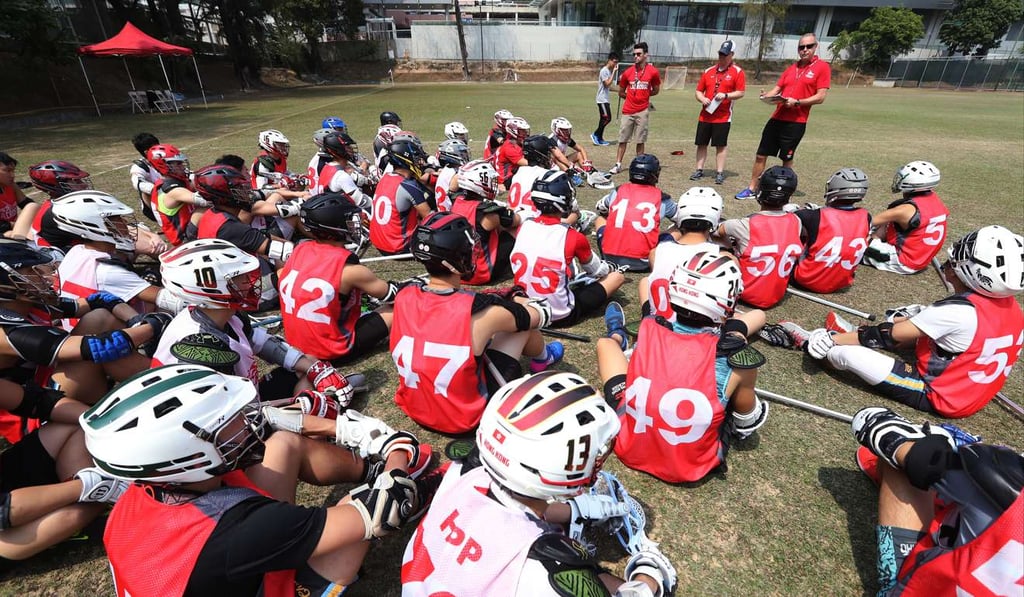 Hong Kong’s men’s team listen to instructions from their coaches.