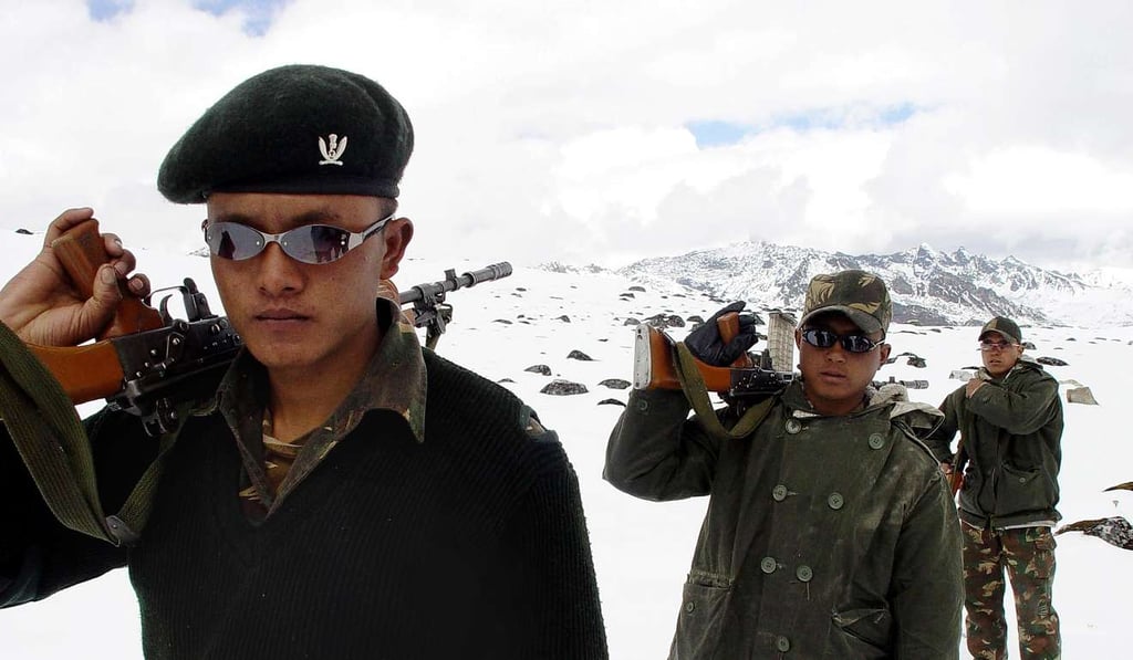 Indian Army soldiers walk along the India-China border near Tawang, some 580km from Itanagar, the state capital of Arunachal Pradesh. India and China fought a bitter border war in 1962, with Chinese troops advancing deep into Arunachal Pradesh and inflicting heavy casualties. Photo: AFP