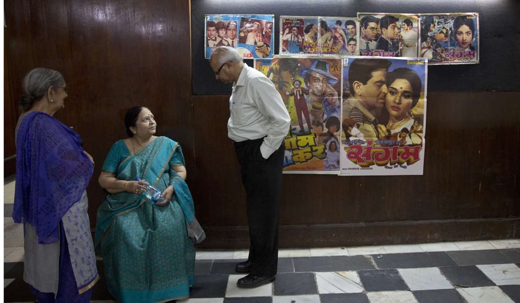 elderly Indians arrive to watch the last movie screening at Regal Theatre. photo; AP