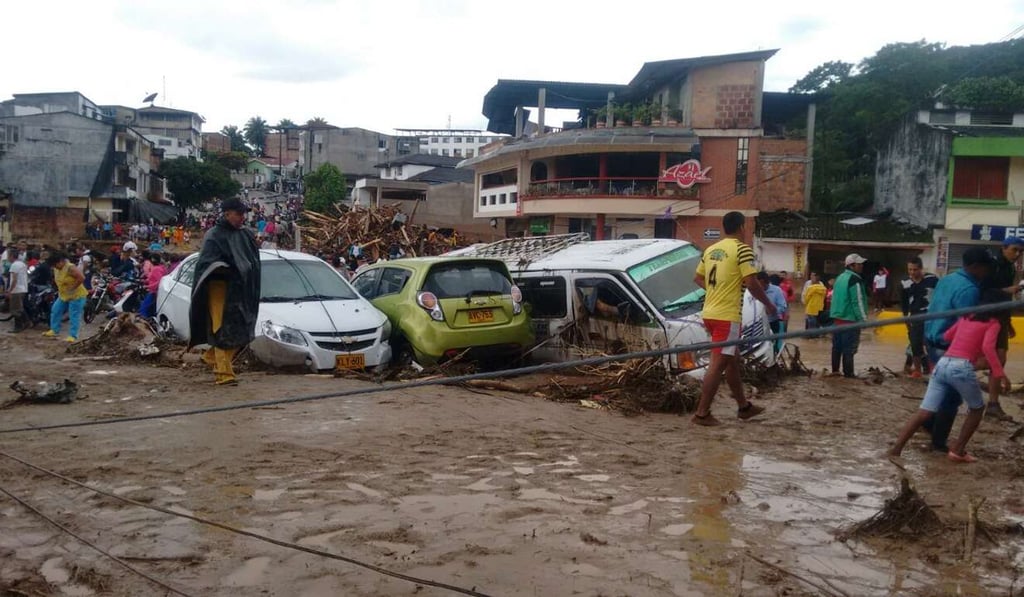Residents clean debris after a landslide in Mocoa, capital city of Putumayo department, Colombia. Photo: Xinhua