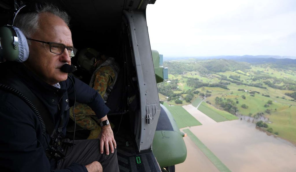 Australian Prime Minister Malcolm Turnbull surveys the flood damage from an Australian Army MRH-90 helicopter in Murwillumbah, New South Wales. Photo: EPA