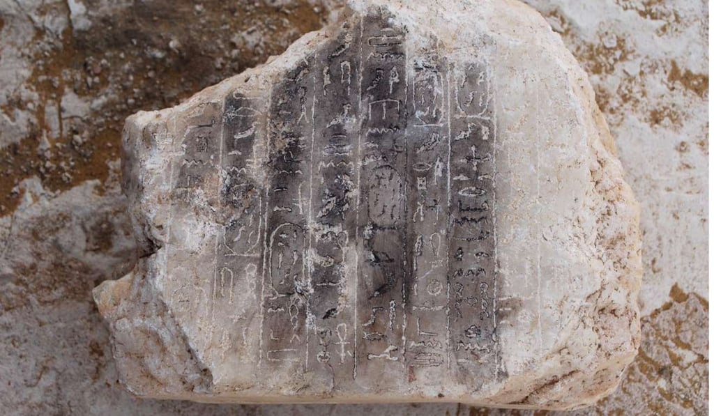 An alabaster block engraved with hieroglyphic lines was among the finds at the remains of an ancient Egyptian pyramid discovered near the well-known bent pyramid of King Snefru in Dahshur, south of Cairo. Photo: AFP