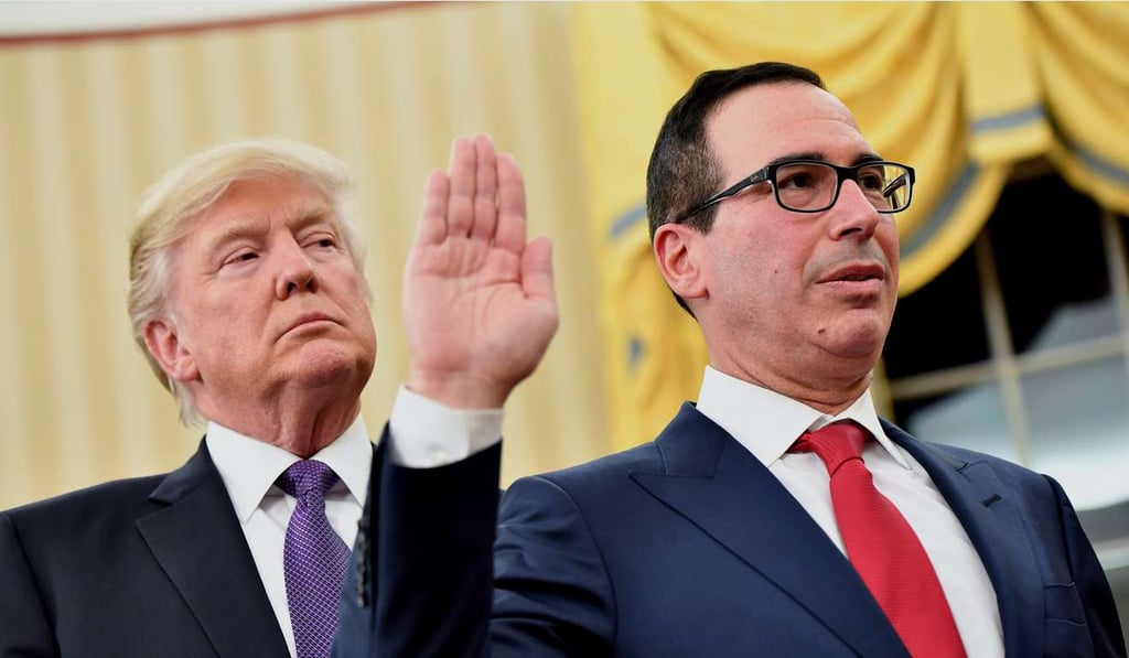 US Treasury secretary Steven Mnuchin (right) is sworn into office at the White House on January 13 as President Donald Trump looks on. A Treasury Department report which has the power to designate China as a currency manipulator is due on April 15. Photo: Bloomberg