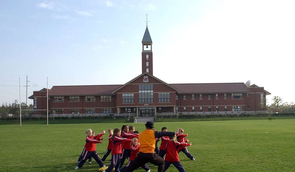 Pupils exercise on the sports field at Dulwich College, Shanghai. Dulwich is one of Britain’s public schools that has opened spin-offs in China. Photo: Handout
