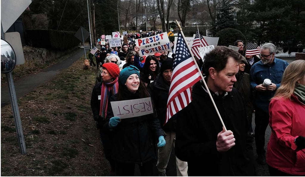 People march in Westport, Connecticut, to protest against the policies and presidency of Donald Trump last month. UN human rights investigators have warned that Trump, with his intolerance for dissent, was seriously threatening Americans’ right to peaceful protest. Photo: AFP People march in Westport, Connecticut, to protest against the policies and presidency of Donald Trump last month. UN human rights investigators have warned that Trump, with his intolerance for dissent, was seriously threatening Americans’ right to peaceful protest. Photo: AFP