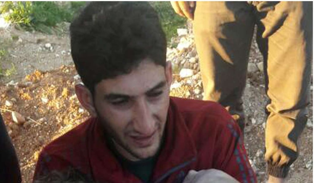 Abdel Hameed Alyousef, 29, weeps over the bodies of his twin babies (obscured) who were killed along with his wife and 19 other members of his extended family in Tuesday’s gas attack in Syria. Photo: Alaa Alyousef via AP