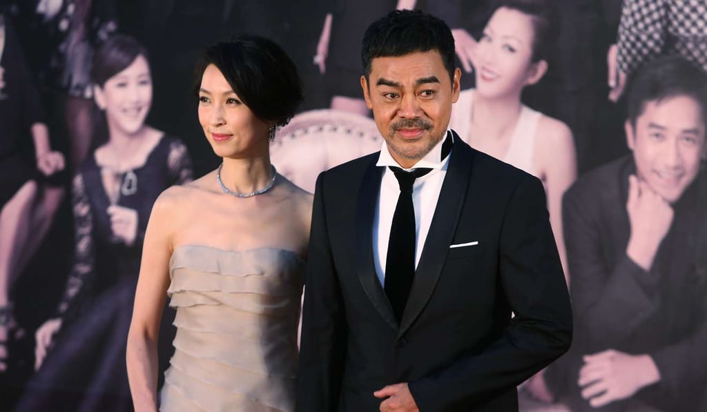 Sean Lau Ching-wan (right) and his wife Amy Kwok posed for photographers on the red carpet of the 32nd Hong Kong Film Awards.
