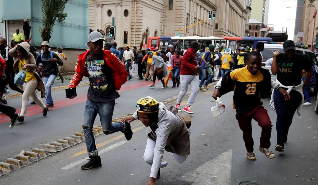 ANC supporters flee from police in Johannesburg. Photo: Reuters