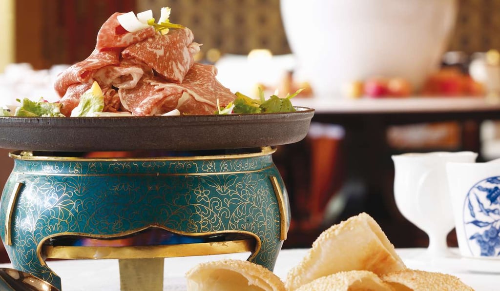 Broiled beef slices served with sesame puffs at Golden Flower