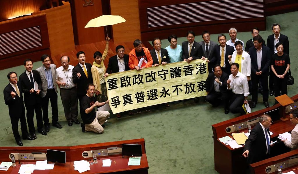 Pan-democratic legislators pose for a photo after rejecting the government’s reform package in a Legislative Council vote in June 2015. Photo: Jonathan Wong