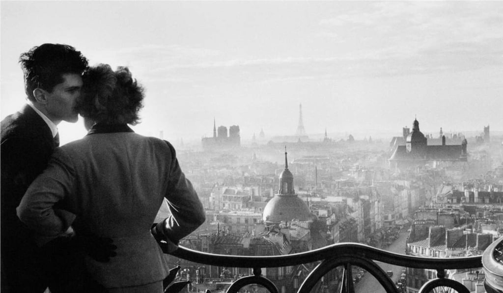 The Paris skyline is largely unchanged since this photo, “Les Amoureux de la Bastille”, by Willy Ronis, was taken in 1957. Photo: Willy Ronis Mediatheque