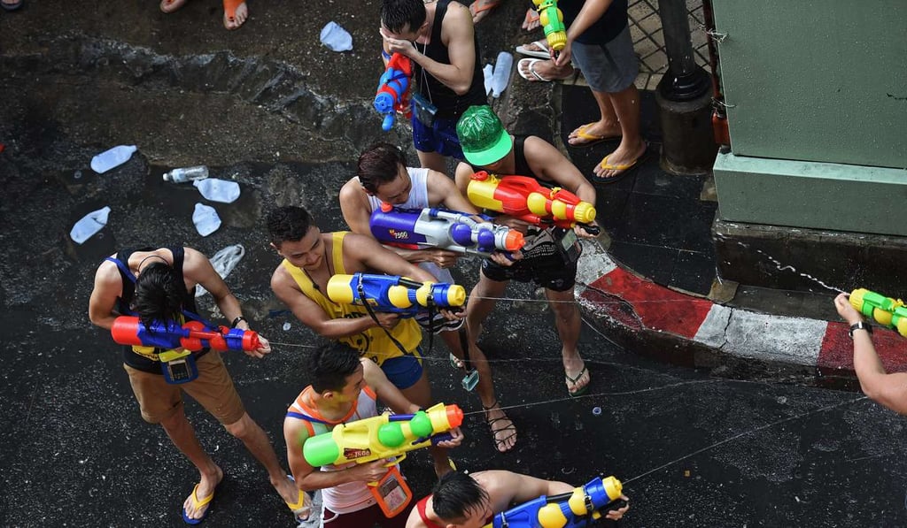 People take part in water battles as they celebrate Songkran, the Thai new year. Photo: AFP