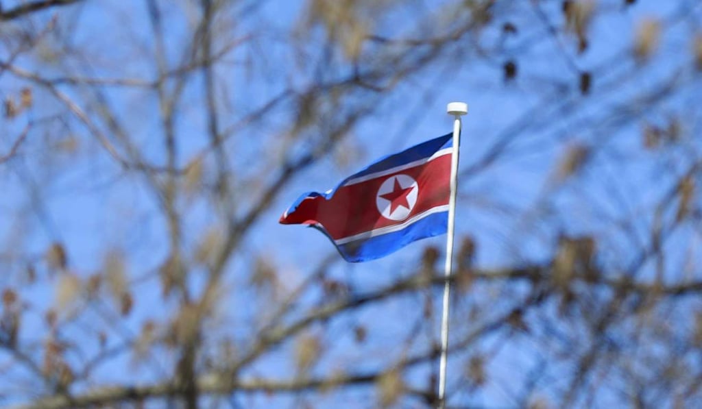 The North Korean flag flying above the embassy in Beijing. Photo: EPA