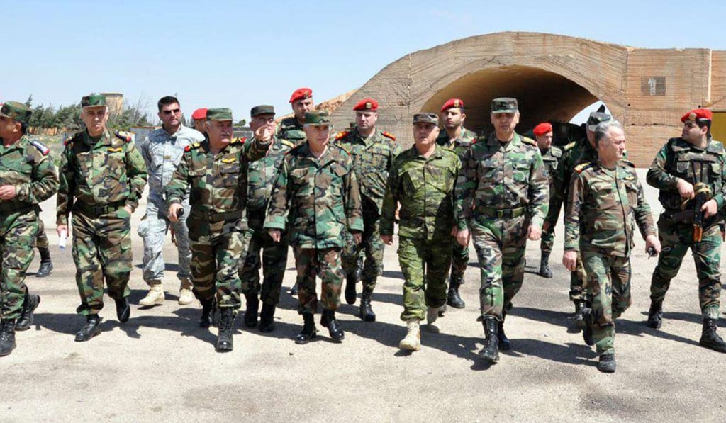 Syrian army officials inspect the damage from US missile attacks at al-Shairat Air Base in the southeastern countryside of Homs province. Photo: EPA
