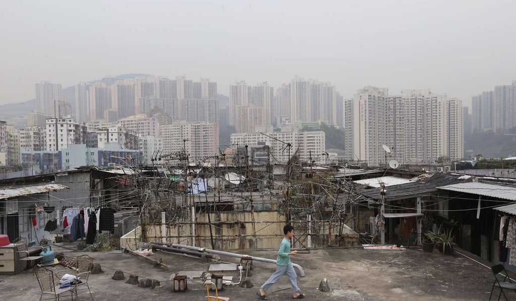 A child plays among illegal cubicle homes on an industrial building’s rooftop in Kwun Tong. Photo: Dickson Lee