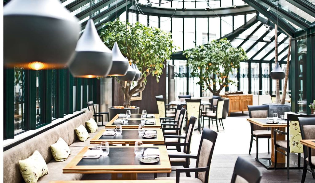 The Clementine in the Garden Pavilion restaurant at the Palais Coburg in Vienna offers a spacious and bright dining experience.