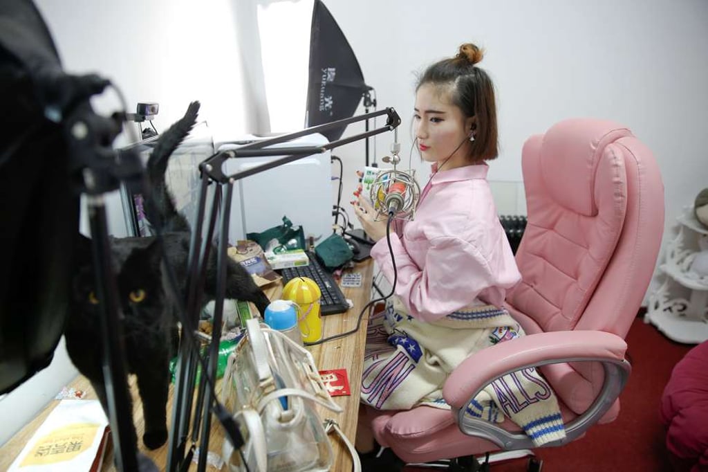 A girl broadcasts at live streaming talent agency Three Minute TV in Beijing. About half of China’s more than 700 million internet users watched live streams in December. Photo: Reuters