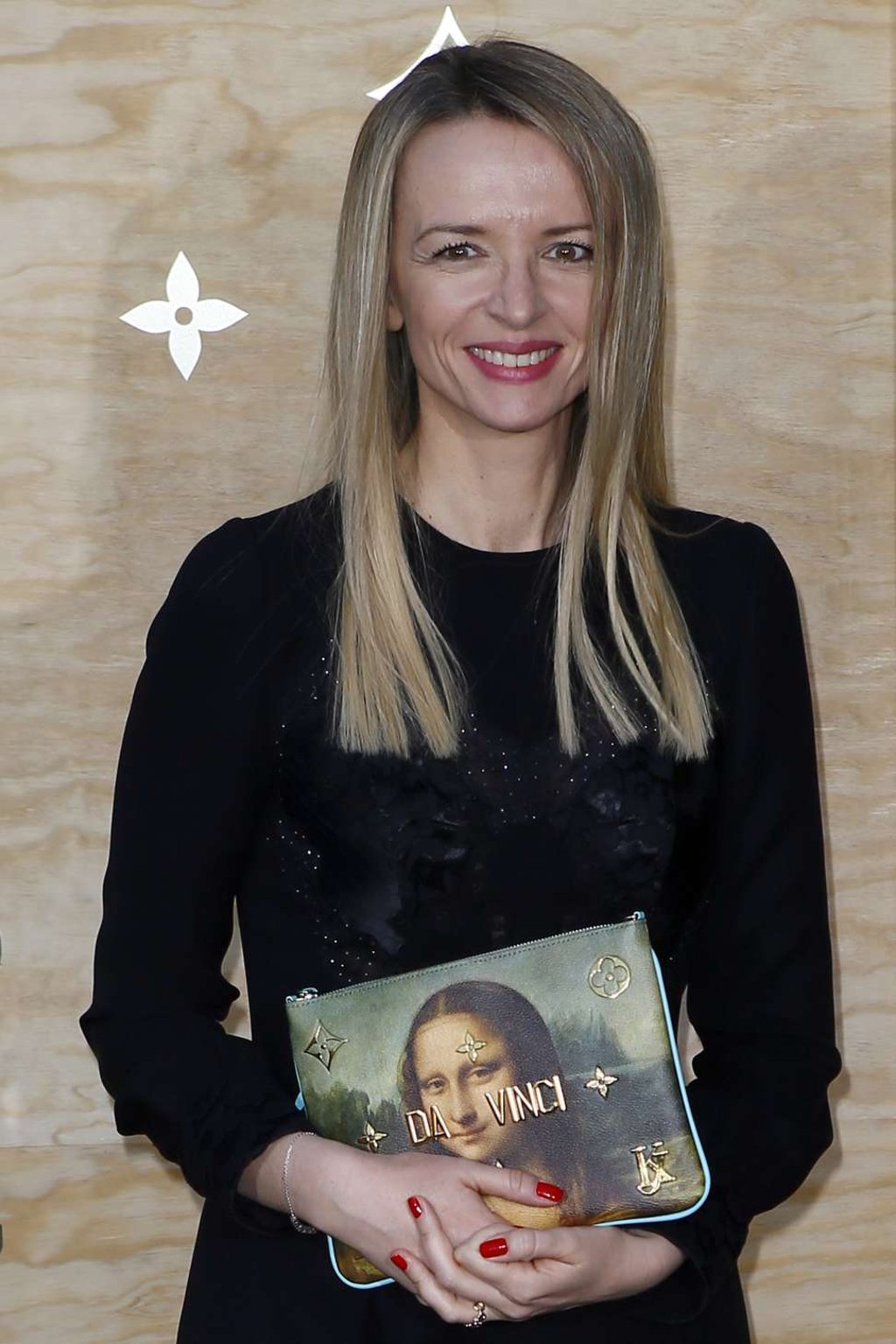 Director and executive Vice President of Louis Vuitton Delphine Arnault poses during a photocall ahead of a diner for the launch of a Louis Vuitton leather goods collection in collaboration with US artist Jeff Koons, at the Louvre Museum in Paris, Tuesday, April 11, 2017. (AP Photo/Francois Mori) Director and executive Vice President of Louis Vuitton Delphine Arnault poses during a photocall ahead of a diner for the launch of a Louis Vuitton leather goods collection in collaboration with US artist Jeff Koons, at the Louvre Museum in Paris, Tuesday, April 11, 2017. (AP Photo/Francois Mori)
