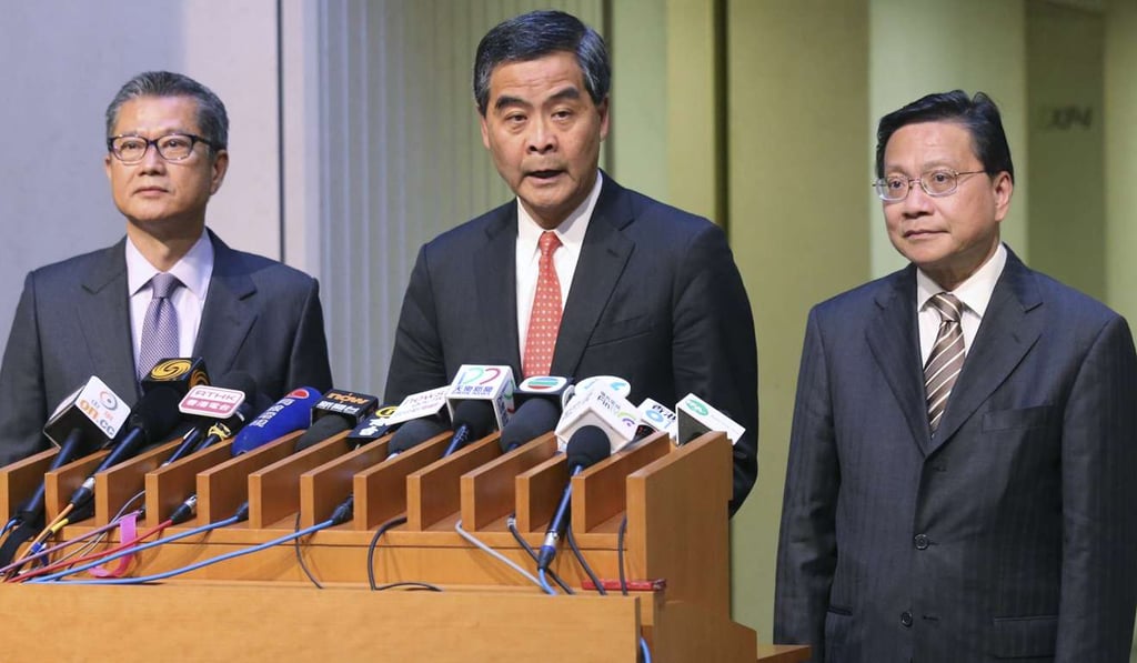 (From left): Financial Secretary Paul Chan, Chief Executive Leung Chun-ying and Secretary for Transport and Housing Anthony Cheung reveal measures to plug a legal loophole which previously allowed speculators to avoid paying stamp duty. Photo: Dickson Lee