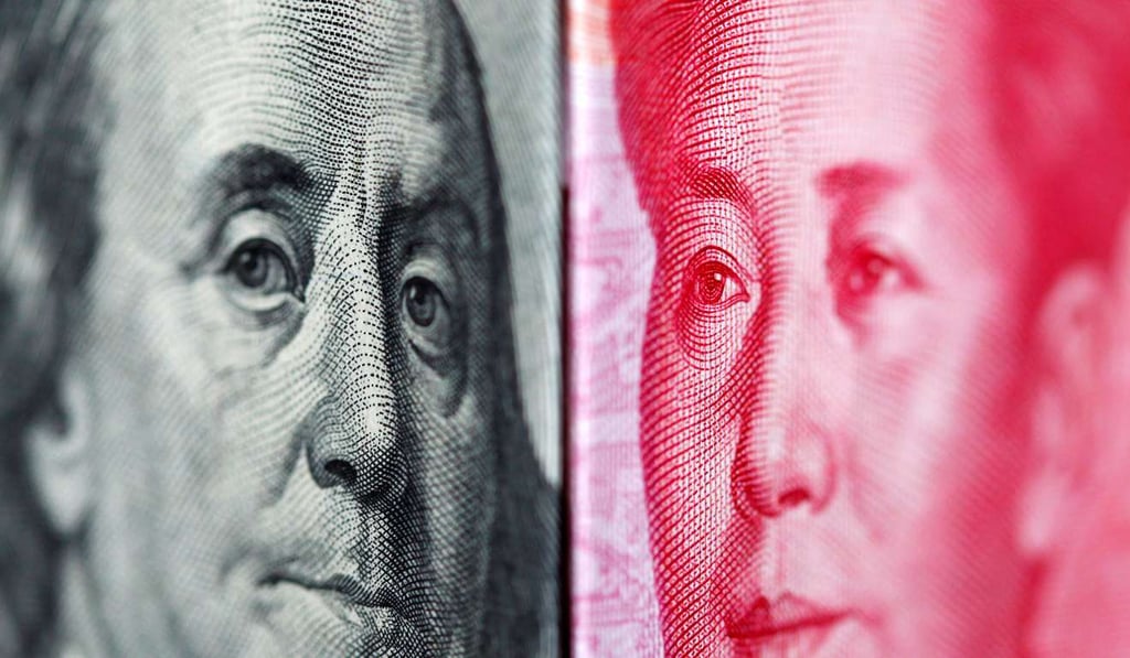 A 100 yuan banknote is placed beside a U.S. 100 dollar banknote as President Donald Trump declared that China is not a currency manipulator. Photo: Reuters