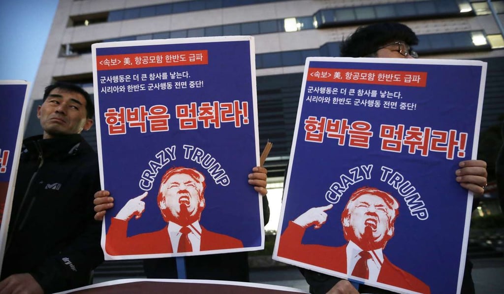 South Korean protesters hold images of US President Donald Trump during a rally denouncing the US' policy against North Korea. Photo: AP South Korean protesters hold images of US President Donald Trump during a rally denouncing the US' policy against North Korea. Photo: AP