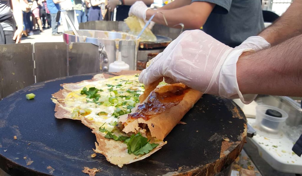 A jianbing cooked on a griddle. Photo: Handout