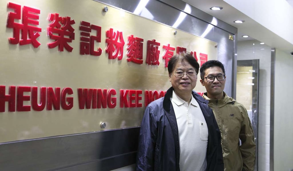 Frankie Hui (left) with his son, Eddy.