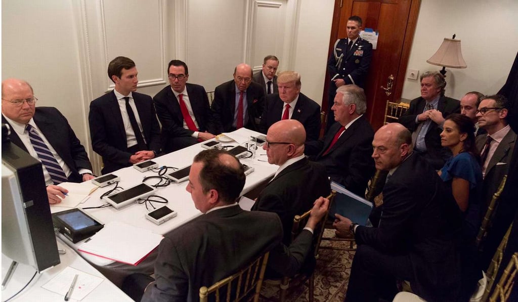 US President Donald Trump meets with his national security team and is briefed via video teleconference after a missile strike on Syria, at his private Mar-a-Lago resort in Florida, on April 6. Photo: The White House via Reuters