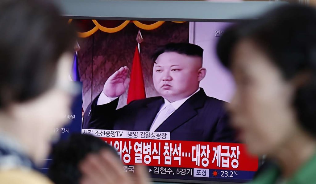 South Koreans watch a North Korean special news report of a parade to mark the 105th anniversary of the birth of North Korea’s founder Kim Il-sung at a station in Seoul on Saturday. Photo: EPA