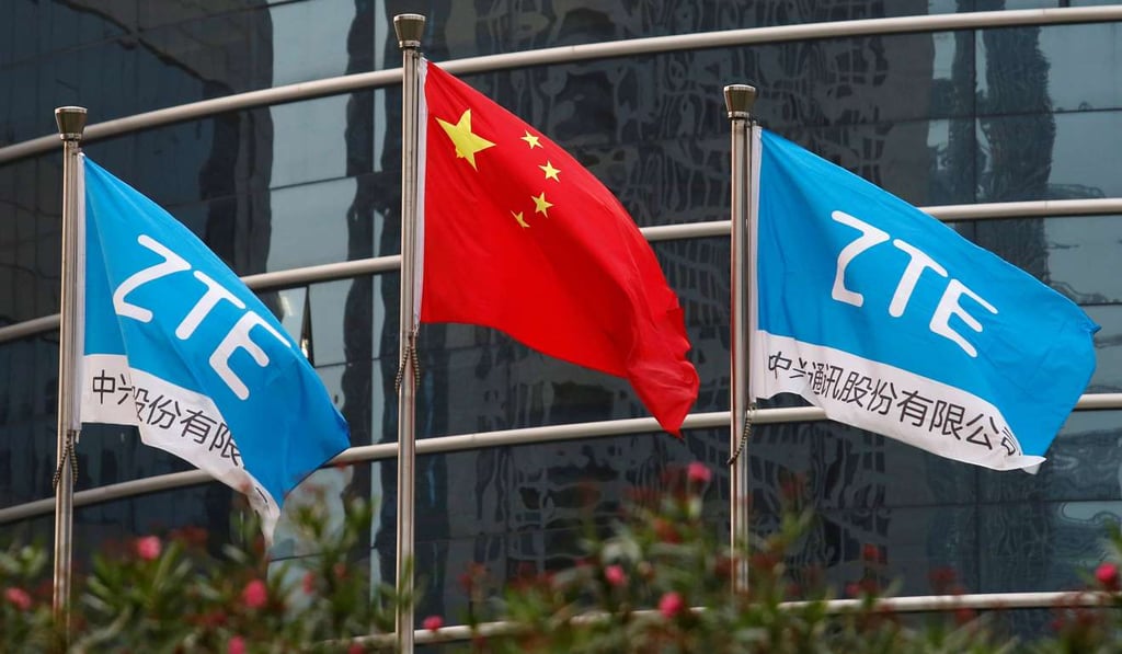 A Chinese flag and two flags bearing the name of ZTE fly outside its R&D building in Shenzhen. Photo: Reuters