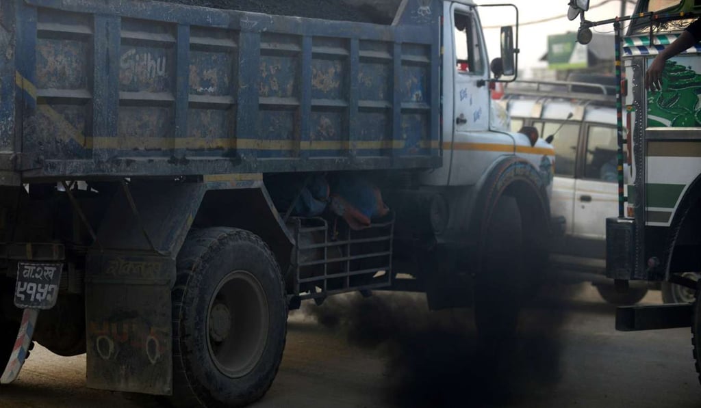 A truck belches out black smoke on a road in Kathmandu. Photo: AFP