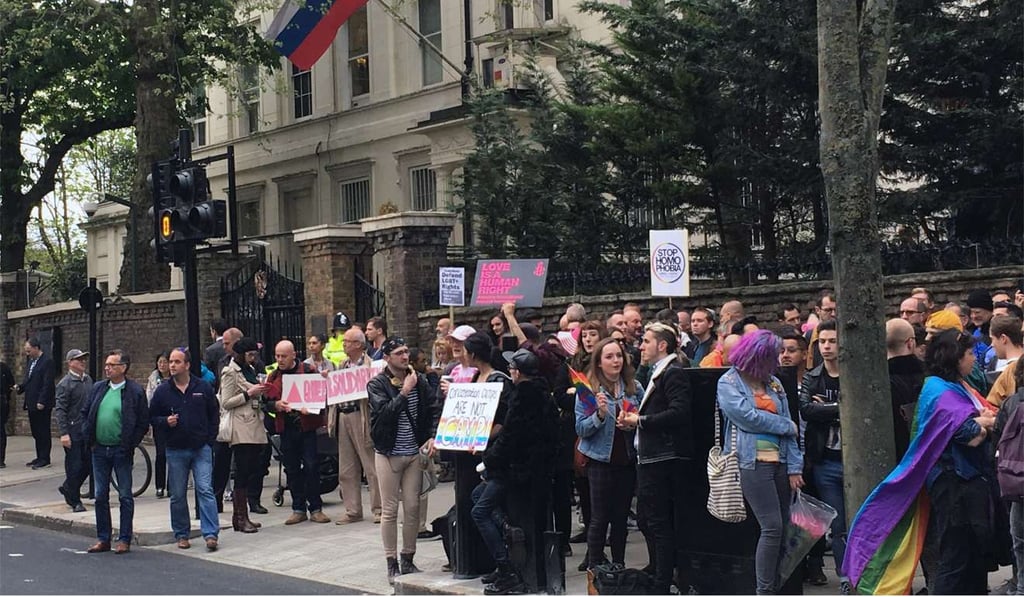 People protest outside the Russian Embassy in London on April 12, following reports of the torture and murder of gay men in Chechnya. Photo: AP