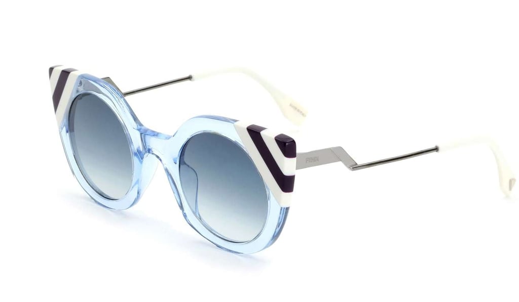 The pale mint shade of the transparent blue acetate frame and the light blue gradient round the lenses make for a cool accessory. Price on request