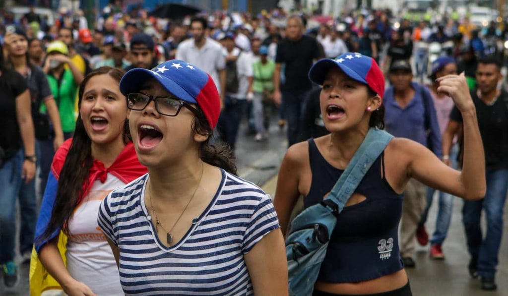 Venezuelans participate in a demonstration against the government in Caracas last week. Photo: EPA Venezuelans participate in a demonstration against the government in Caracas last week. Photo: EPA