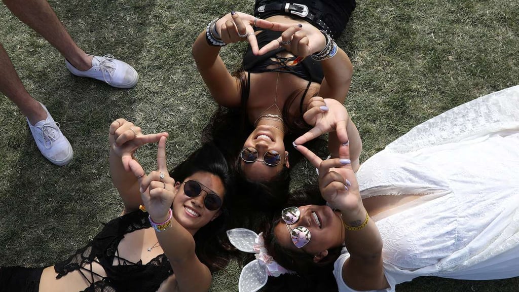 People pose for photos during the Coachella Festival in California. Photo: Reuters