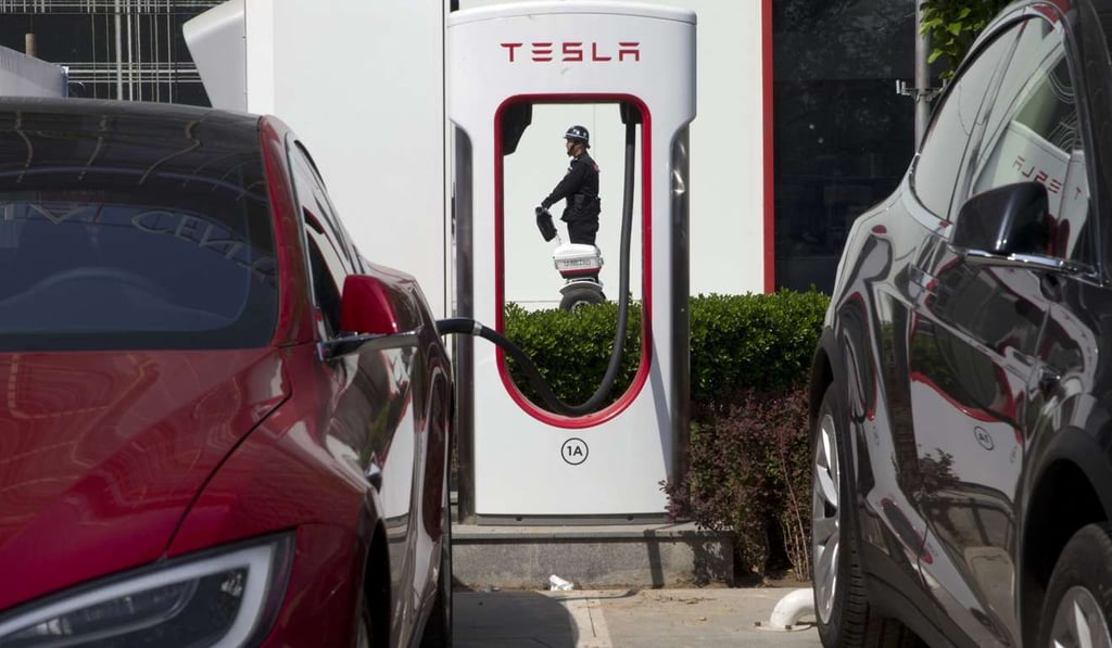 An electric vehicle charging station in Beijing. Automakers face a conflict in China's huge but crowded market: Regulators are pushing them to sell electric cars, but buyers want gasoline-hungry SUVs. Photo: AP