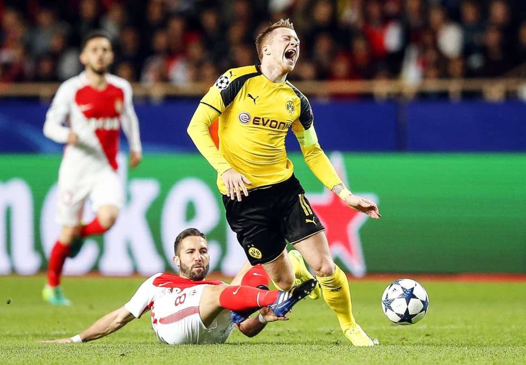 Monaco’s Joao Moutinho in action against Dortmund’s Marco Reus. Photo: EPA