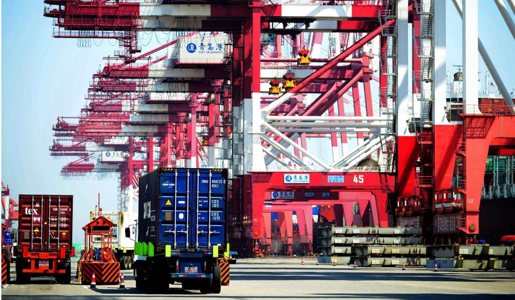 Trucks transport shipping containers at a port in Qingdao, east China's Shandong province. Shipping by train from China to Europe would be faster than by sea, but also much more expensive. Photo: AFP