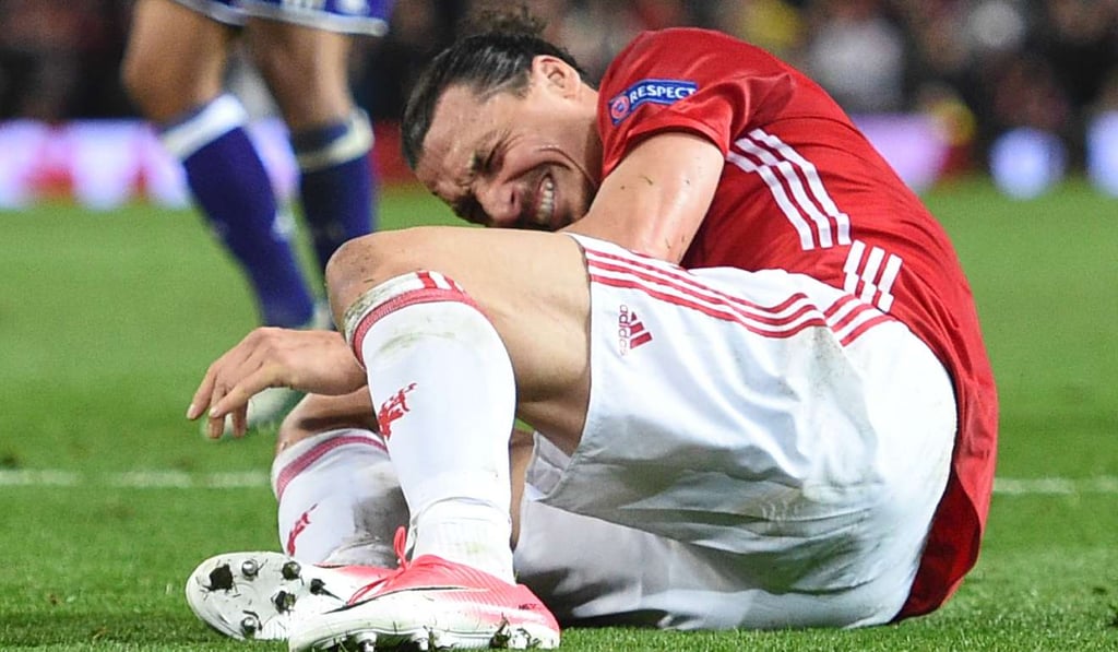 Manchester United's Swedish striker Zlatan Ibrahimovic reacts after falling awkwardly against Anderlecht. Photo: AFP