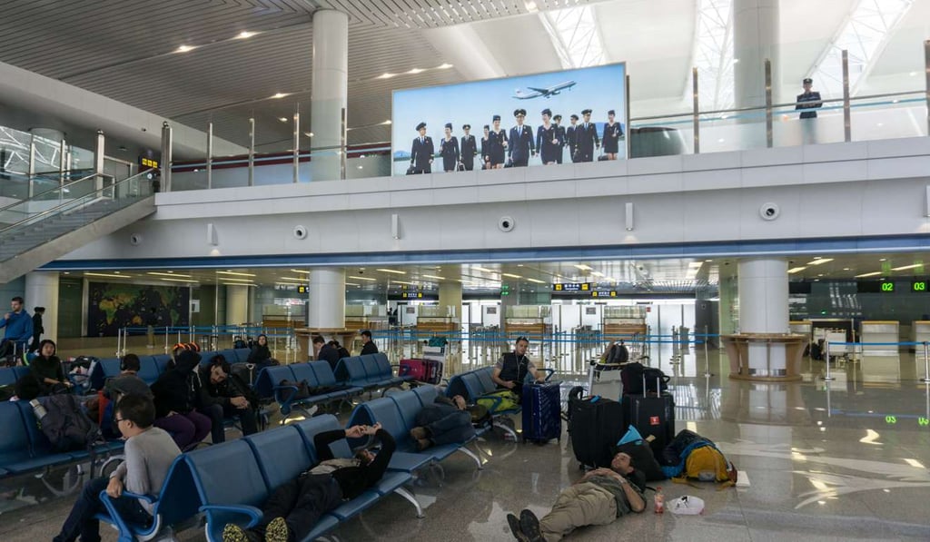 Travellers wait at Pyongyang airport. Photo: AFP