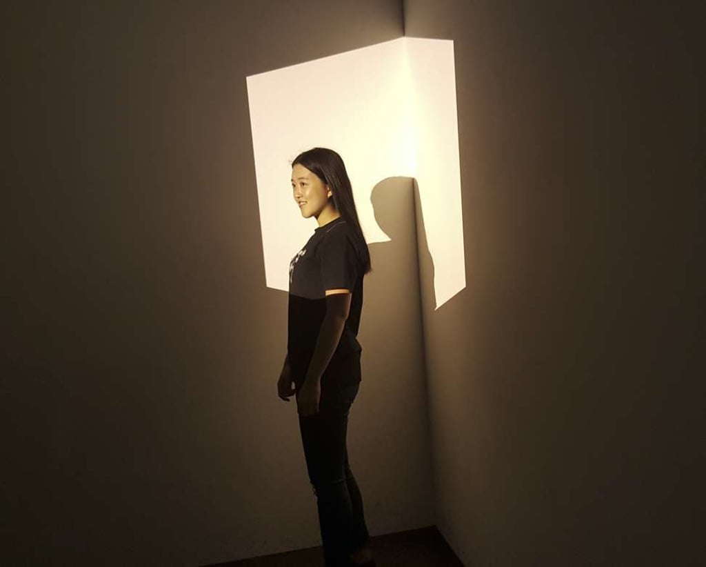 A visitor interacts with one of Turrell’s pieces. Photo: Casey Hall