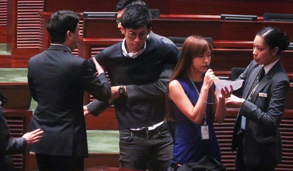Leung and Yau tried to retake their oaths. Photo: Felix Wong