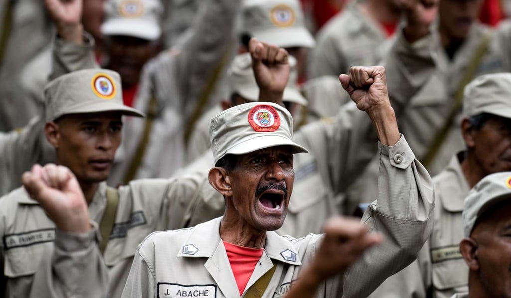 Members of the Bolivarian Militia take part in a parade in the framework of the seventh anniversary of the force, in front of the Miraflores presidential palace in Caracas on April 17. Photo: AFP