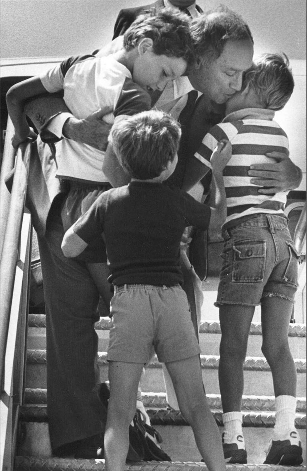 Canada's Prime Minister Pierre Trudeau greets his sons Justin (left), Sacha (right) and Michel after returning home from a foreign trip in Ottawa, in a 1983 file photo. Photo: Reuters